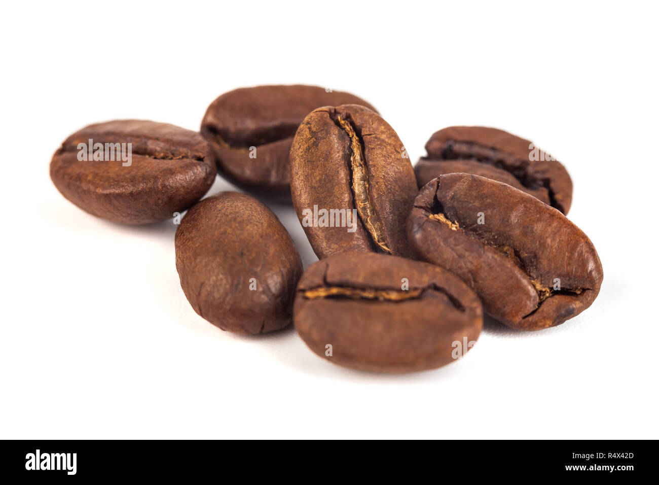 roasted coffee beans isolated on white background Stock Photo - Alamy