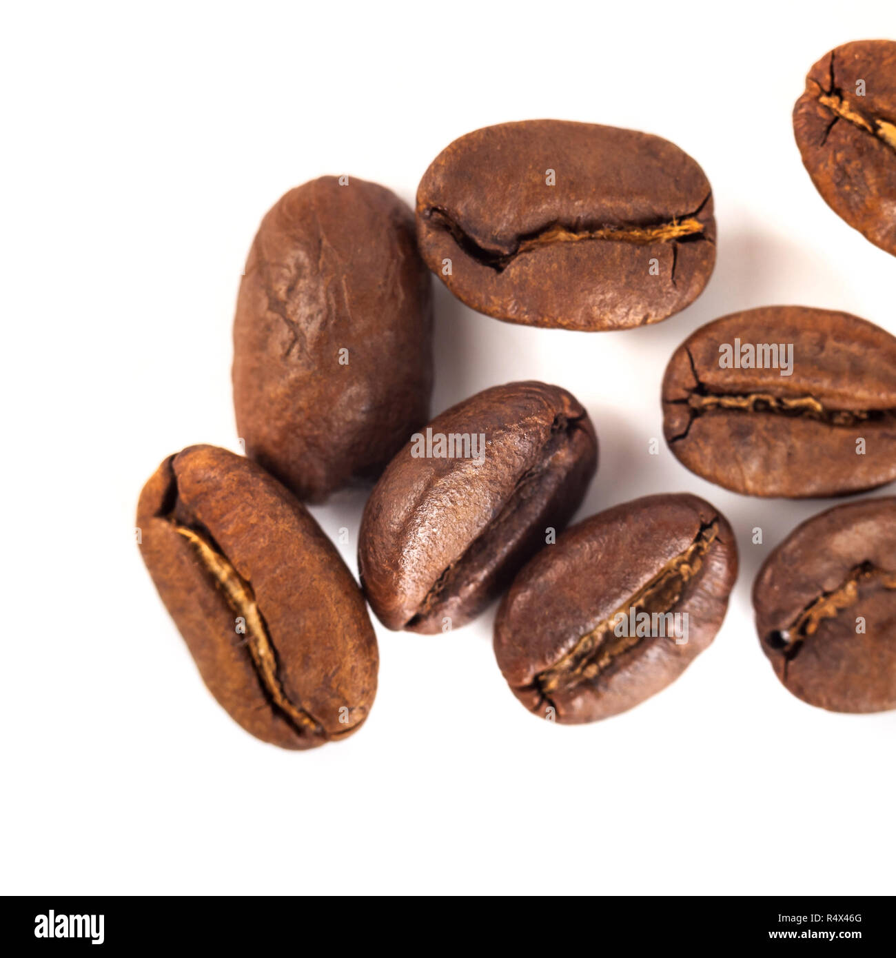 roasted coffee beans isolated on white background Stock Photo - Alamy
