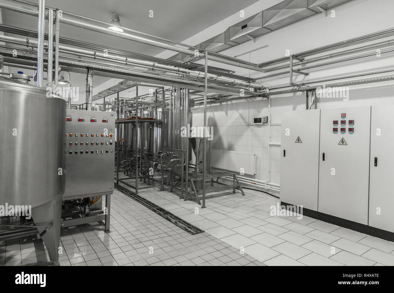 general view of the interior of a milk factory. equipment at the dairy
