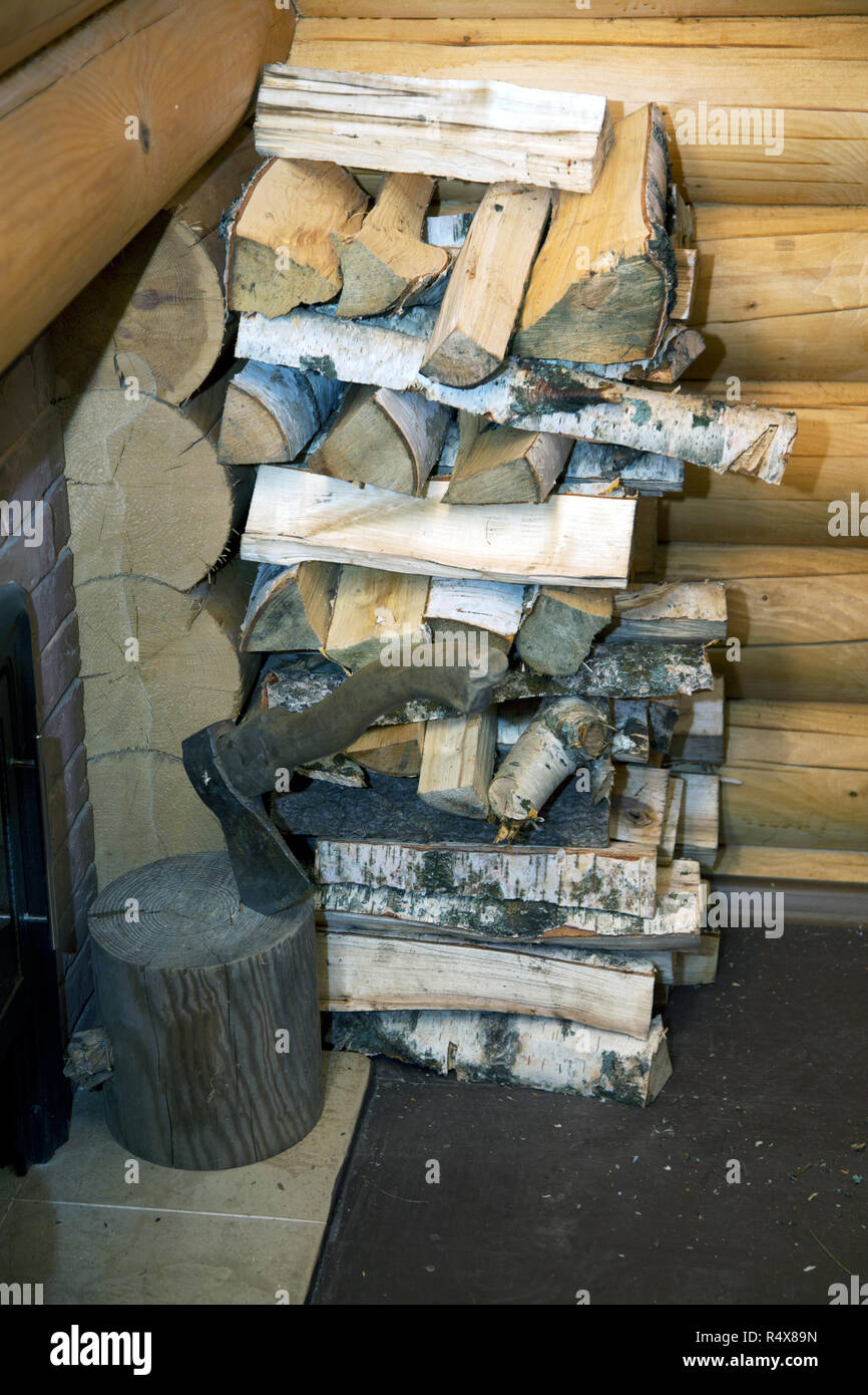 ax and pile of split wood in the bath Stock Photo