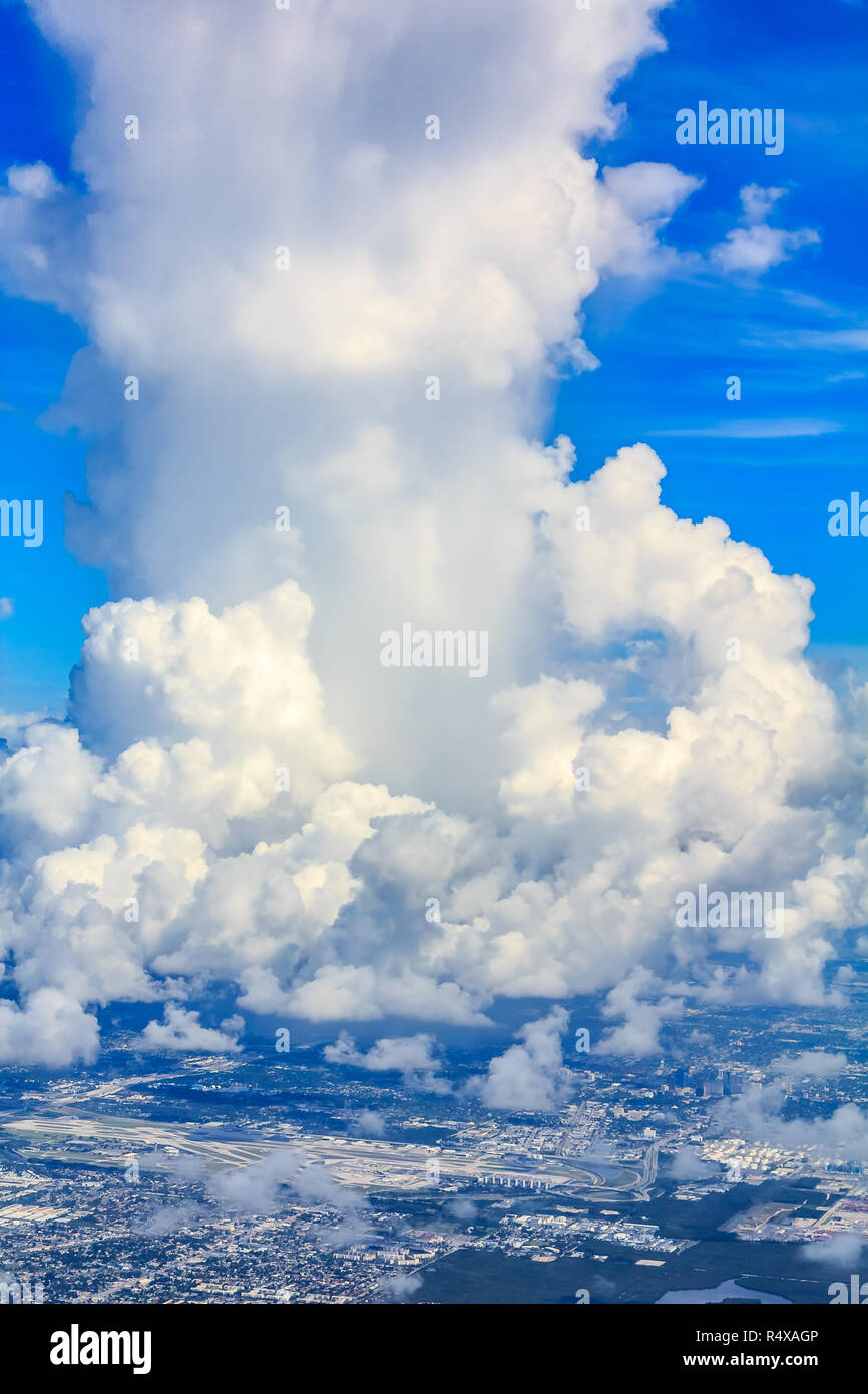 Aerial view of a large and fluffy cumulous cloud above the Miami International Airport in Florida Stock Photo