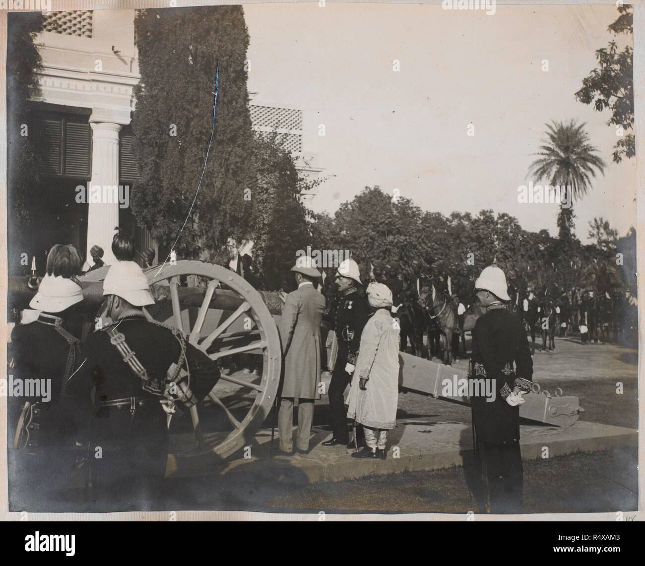 Photograph of Lord Curzon inspecting a cannon with J.R. Dunlop Smith and the Maharaja of Patiala, at Patiala. India; Patiala; Punjab; Punjab (India); Nov 1903. Source: Photo 355/2/(106). Author: ANON. Stock Photo