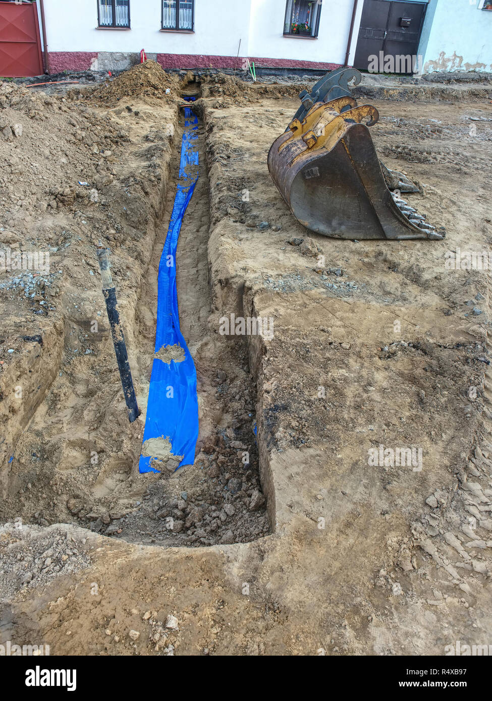 New water pipes tap between main water tube and house. Rebuilding of