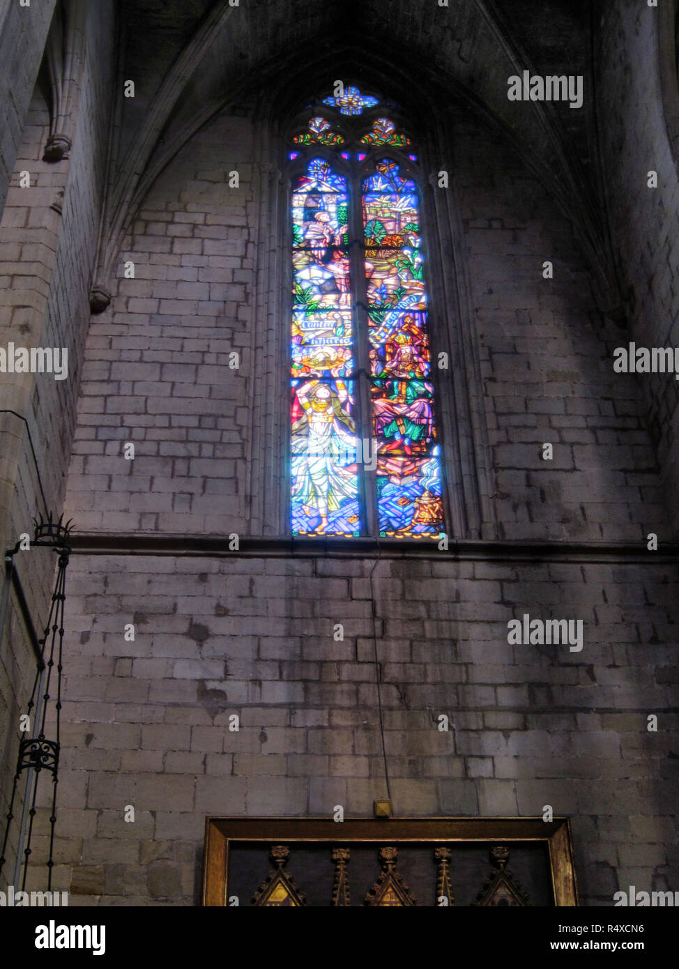 Stained glass window in the romanesque and gothic Collegiate Basilica