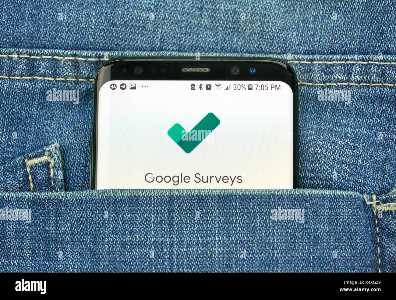 MONTREAL, CANADA - OCTOBER 4, 2018: Google Surveys app on s8 screen. Google is an American technology company which provides a variety of internet ser Stock Photo