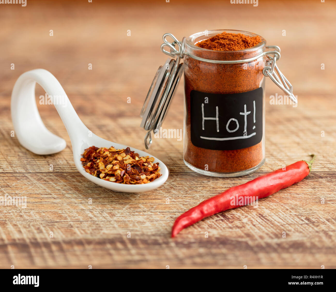 Red Cayenne Pepper with Ground Cayenne Powder and Red Pepper Flake on a