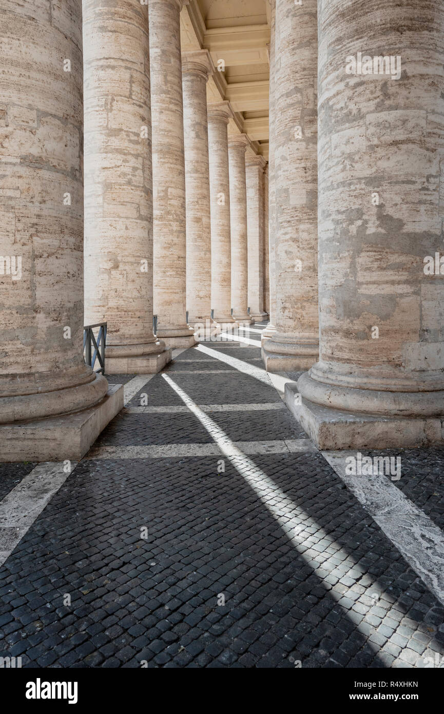 Marble columns of Bernini's Doric colonnade at St Peters in the Vatican Rome Stock Photo