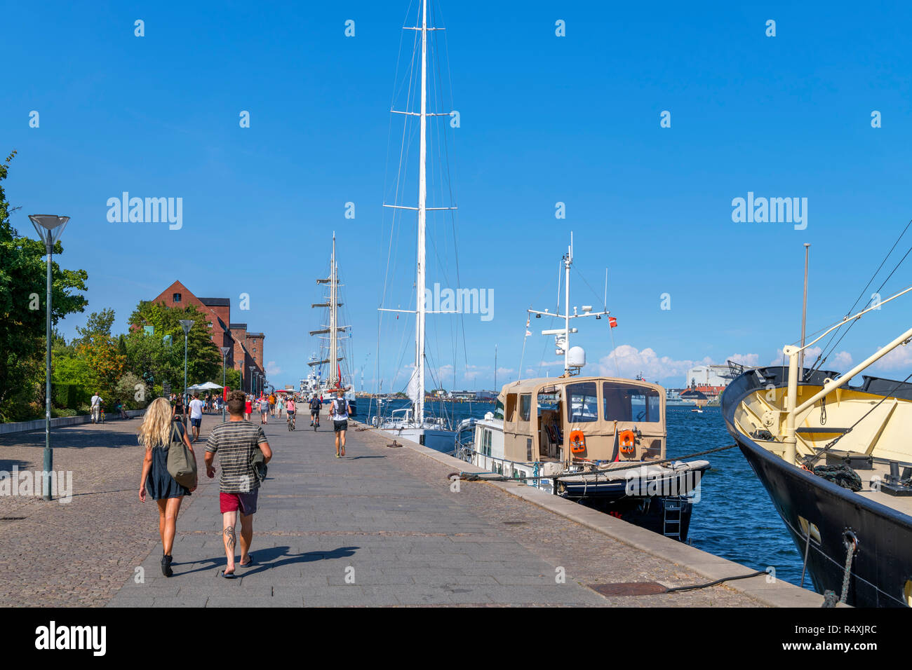 Tourist walking along the waterfront, Promenada Kopenhaga (Larsens Plads), Copenhagen, Denmark Stock Photo