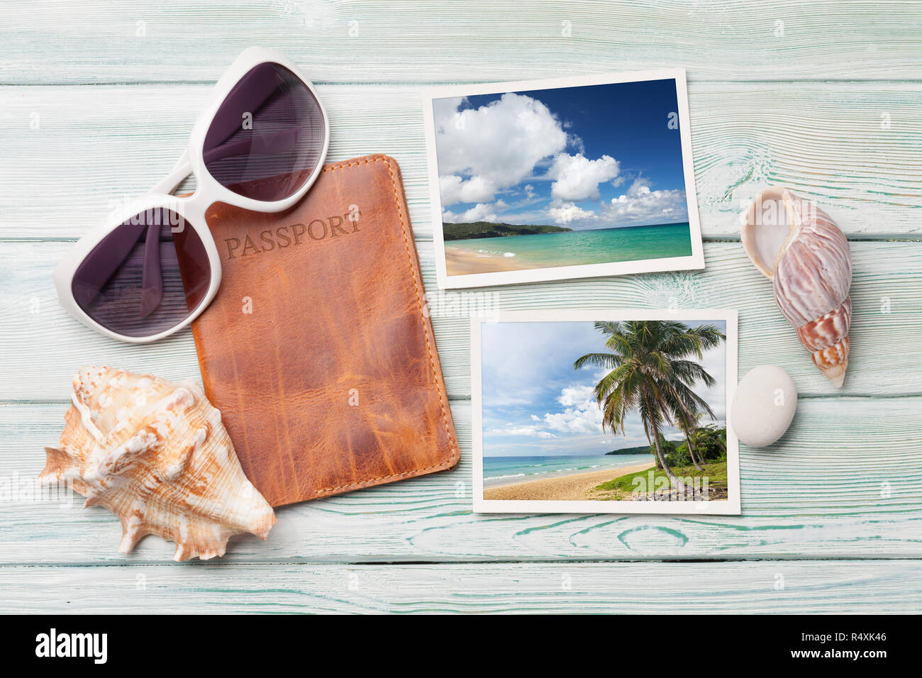 Travel vacation table concept with sunglasses, passport and summer photos on wooden table. Top view. Flat lay. Photos taken by me Stock Photo