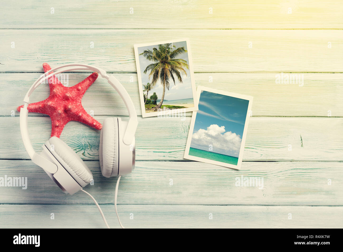 Travel vacation and music concept with headphones, starfish and photos on wooden backdrop. Top view with copy space. Flat lay. All photos taken by me. Stock Photo