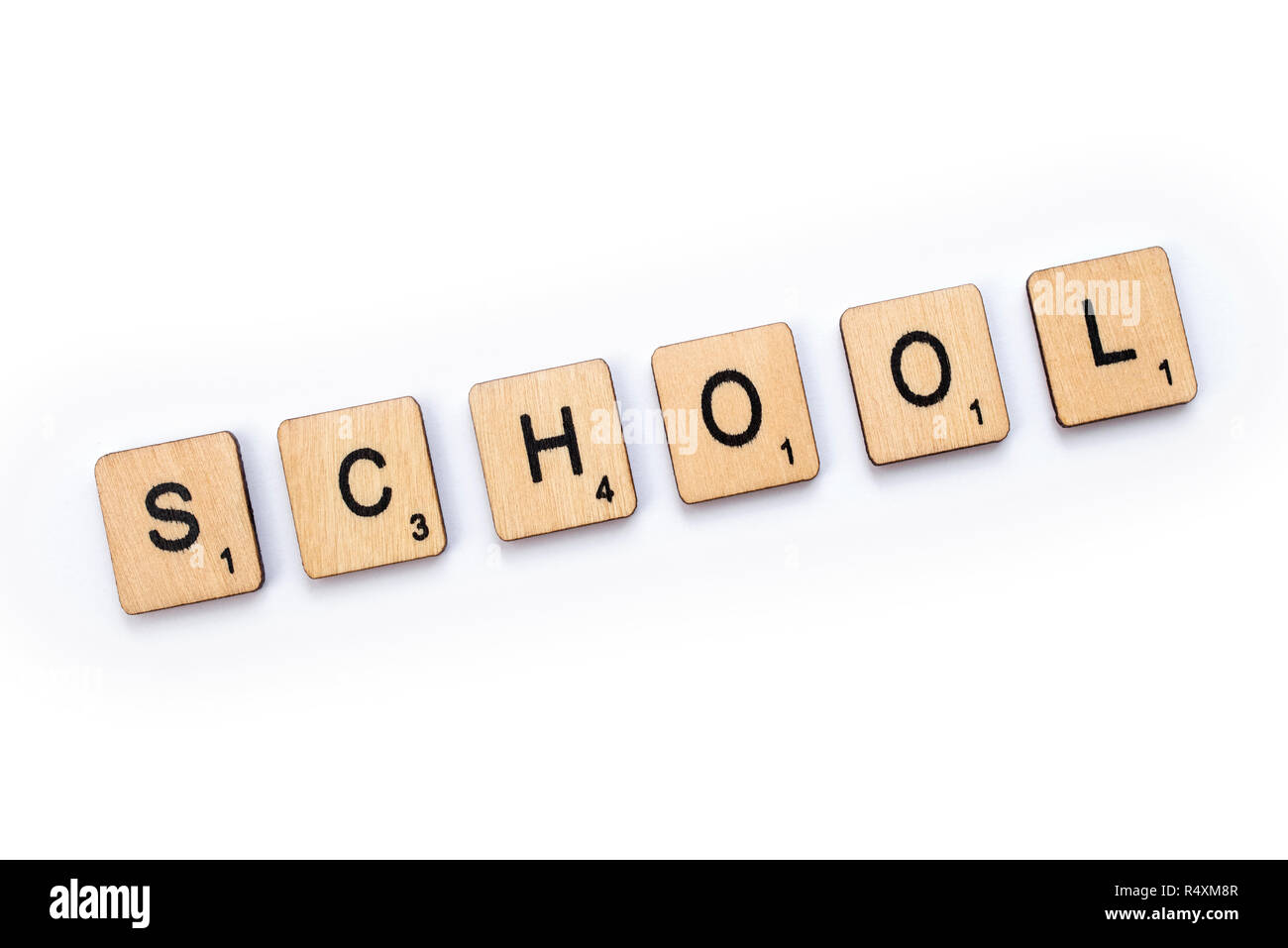 LONDON, UK - JULY 5TH 2018: The word SCHOOL, spelt with wooden letter Scrabble tiles, on 5th July 2018. Stock Photo