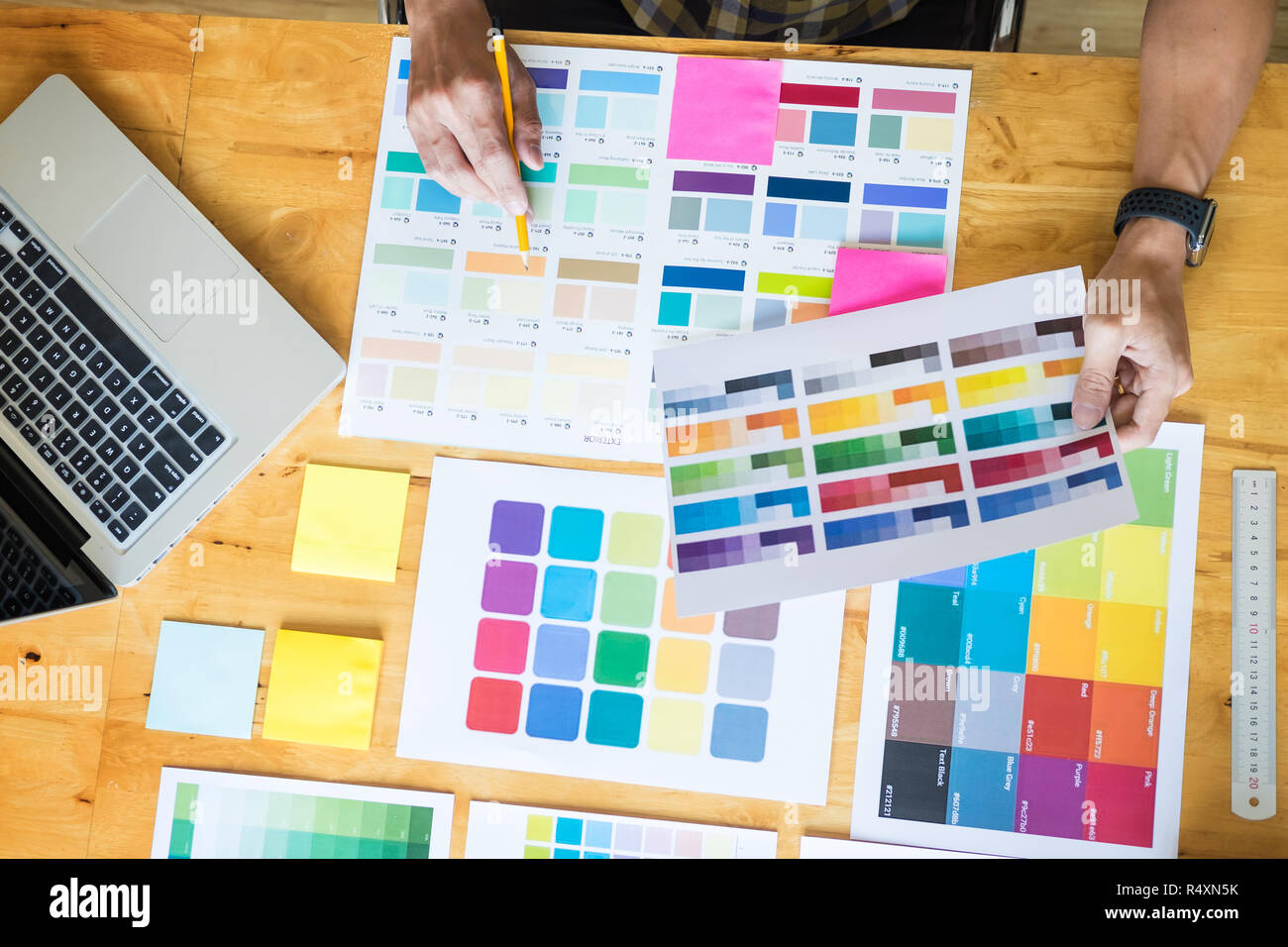 Creative Graphic Designer At Work Color Swatch Samples Pantone Palette In Studio Modern Office Interior Design Renovation And Technology Concept Stock Photo Alamy