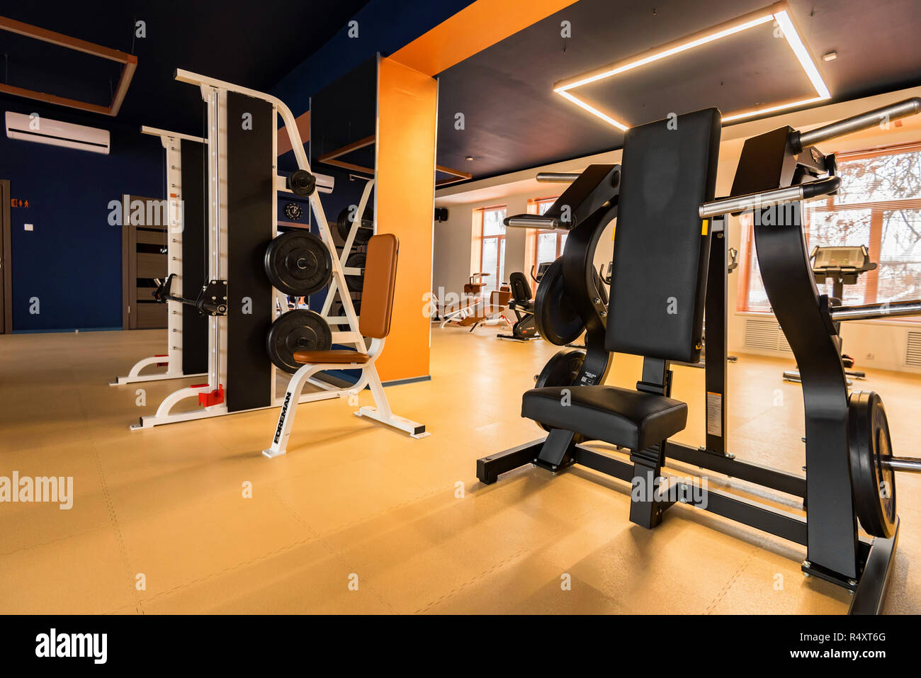 New fitness machines in modern gym interior Stock Photo