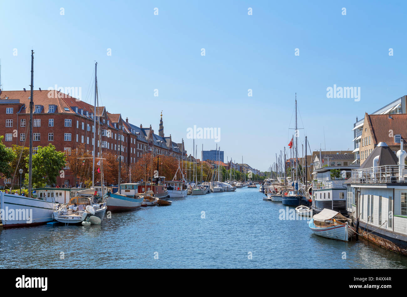 Yachts moored in a canal in Christianshavn viewed from Butterfly 3-way Bridge, Copenhagen, Zealand, Denmark Stock Photo