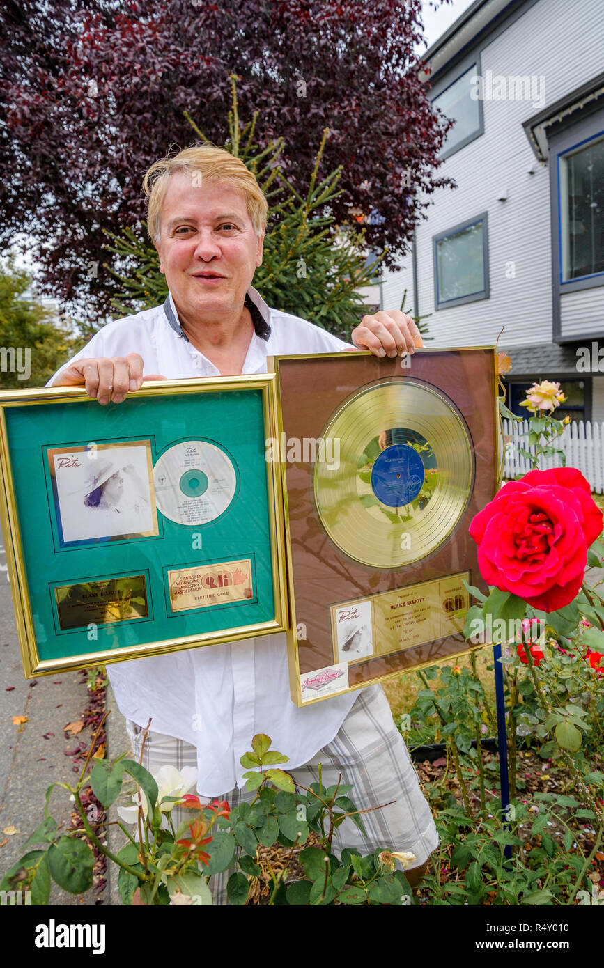 Mister Blake Elliott, former teen recording artist, posing with commemorative records he says were given to him by singer Rita MacNeil. Stock Photo