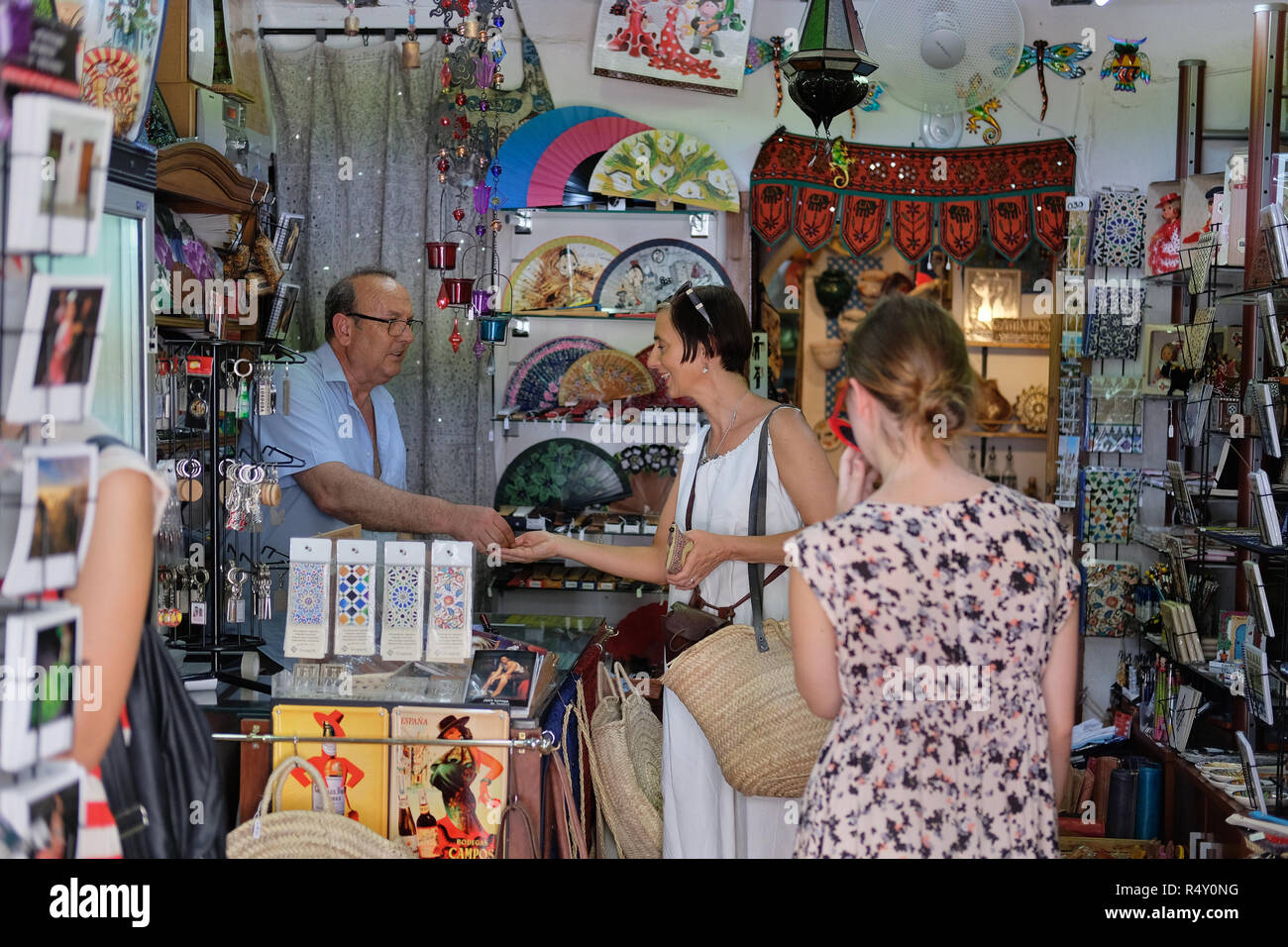 An English tourist in a gift shop in Spain Stock Photo