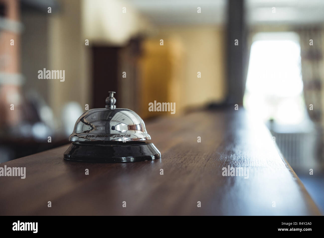 Restaurant Service Bell on the Table in Hotel Reception -  Vintage with Bokeh, Daylight Background - Business Concept Stock Photo