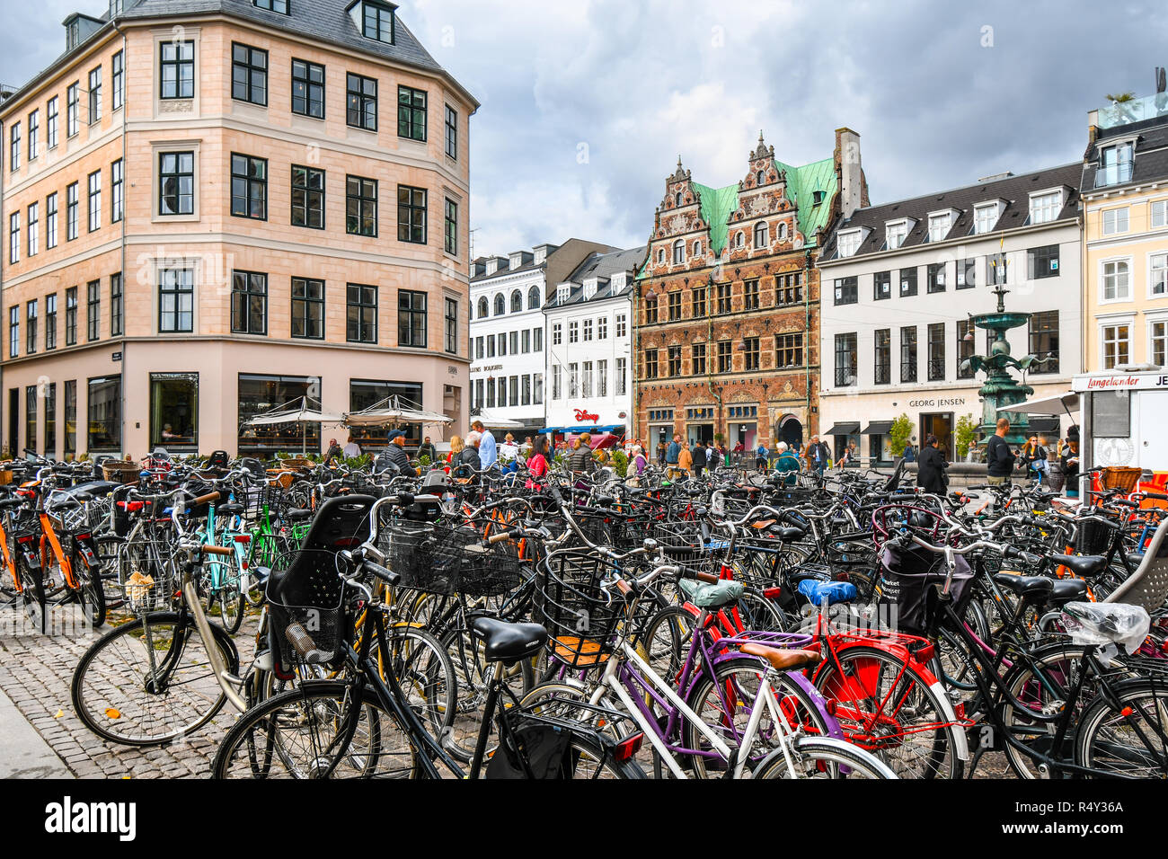 Bicycles parked alongside the Stroget shopping district, the longest pedestrian street in the world, in the historic center of Copenhagen, Denmark. Stock Photo
