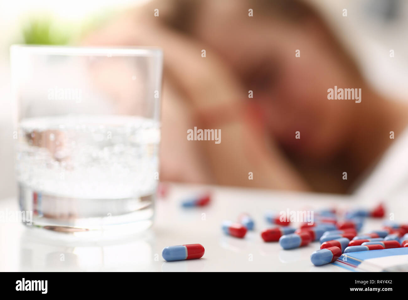 woman is ill take drugs sleep in bed Stock Photo