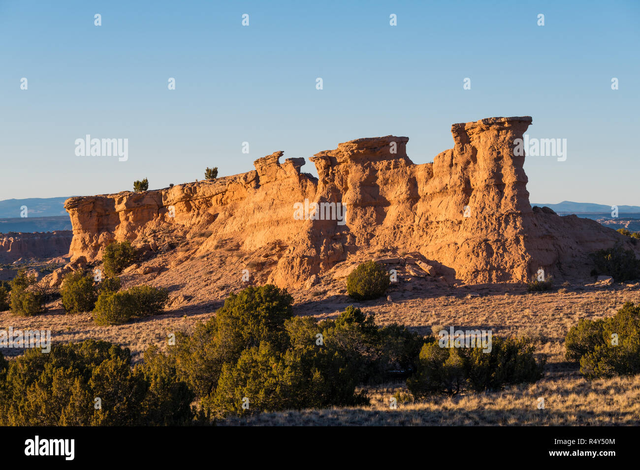 Red rock formation glowing in the golden light of sunset  near Santa Fe, New Mexico Stock Photo