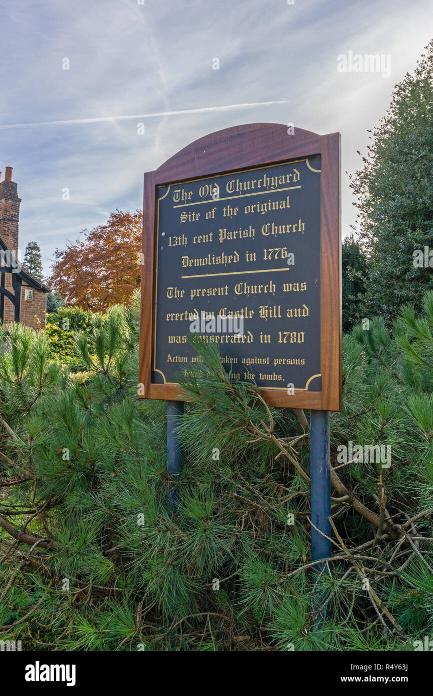 Sign for The Old Churchyard, Buckingham, UK; marks the site of the town's original medieval church which after the spire collapsed was rebuilt nearby. Stock Photo