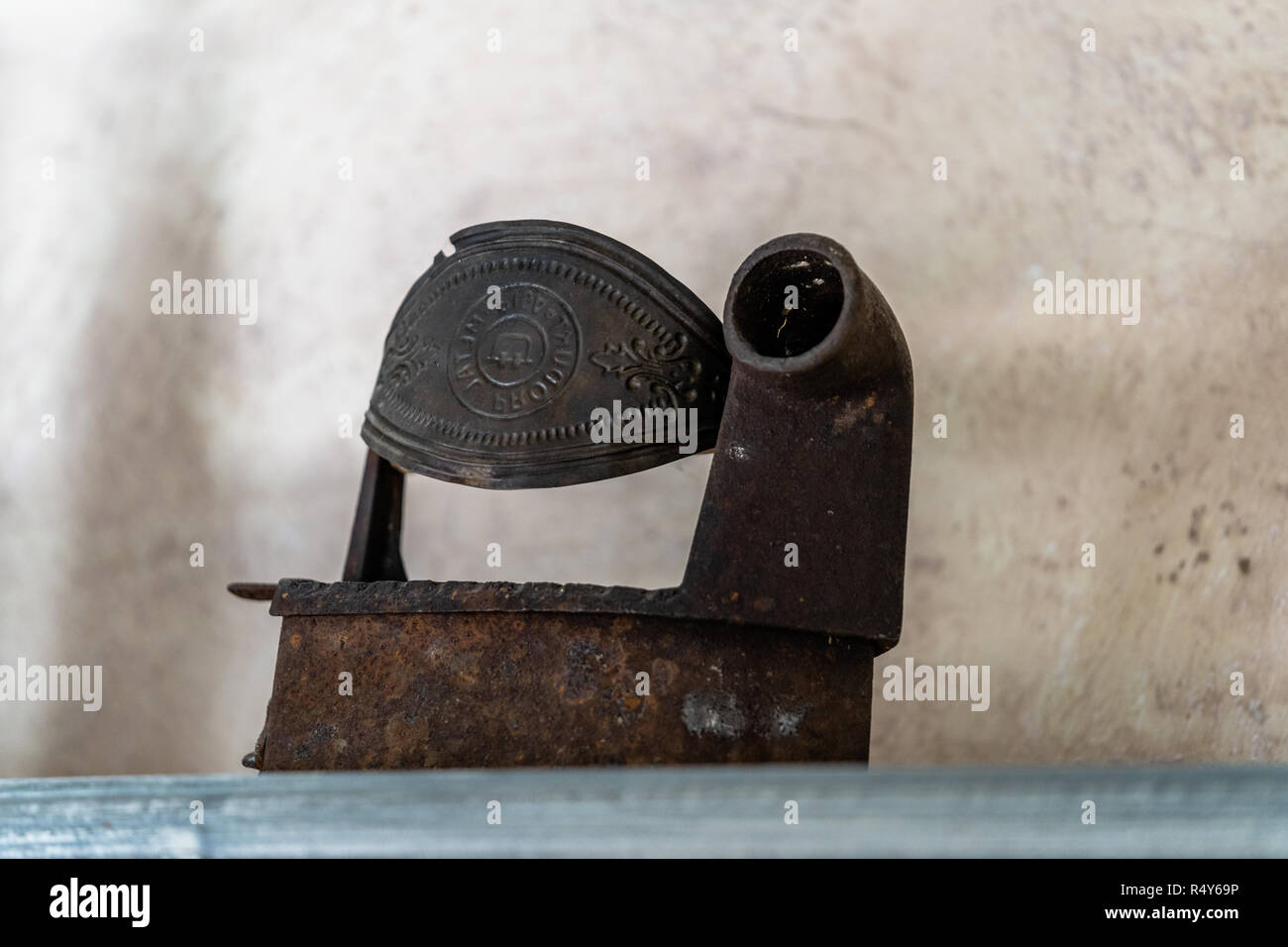 Old Iron Standing on the Shelf - Isolated Object Stock Photo