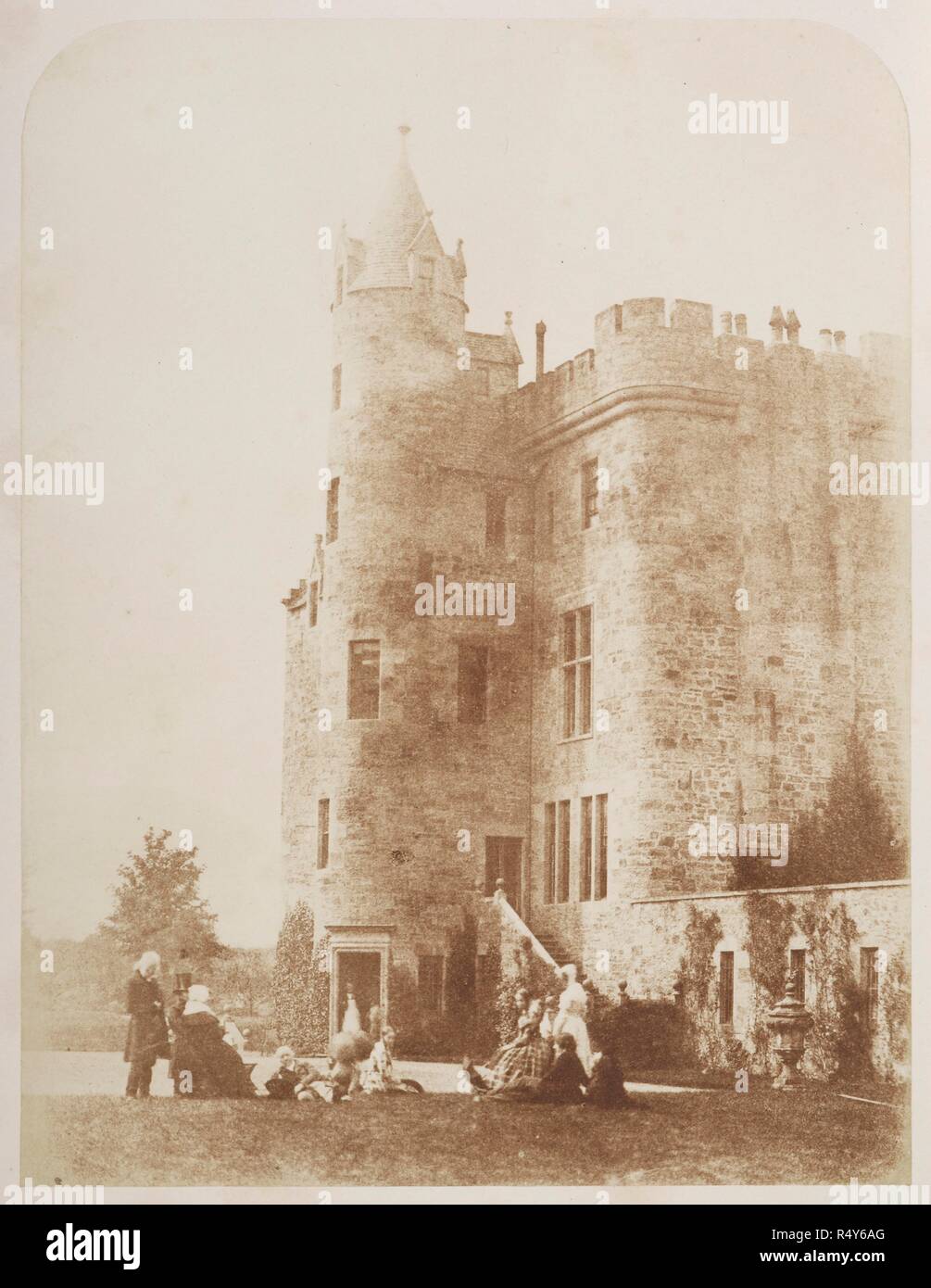 Bonaly. Group of Lord Cockburn's family posed on the lawn of Bonaly Towers. Presumably taken on the same occasion as print 69, this view is primarily an architectural rather than a portrait study, the emphasis directed towards the castle rather than to the group in the foreground. The group includes John Henning, Mrs Cockburn, Lord Cockburn, Mrs Cleghorn and David Octavius Hill. One Hundred Calotype Sketches by D. O. Hill, R.S.A. and R. Adamson. Edinburgh. From a volume of calotype images and portraits. Early photographic technique also called Talbotype. Dating from 1849. David Octavius Hill a Stock Photo