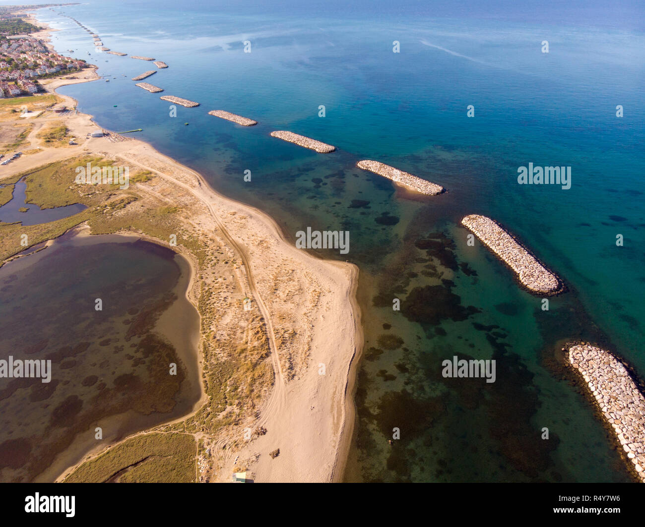 Aerial view of the coastline with waterbreak. Stock Photo