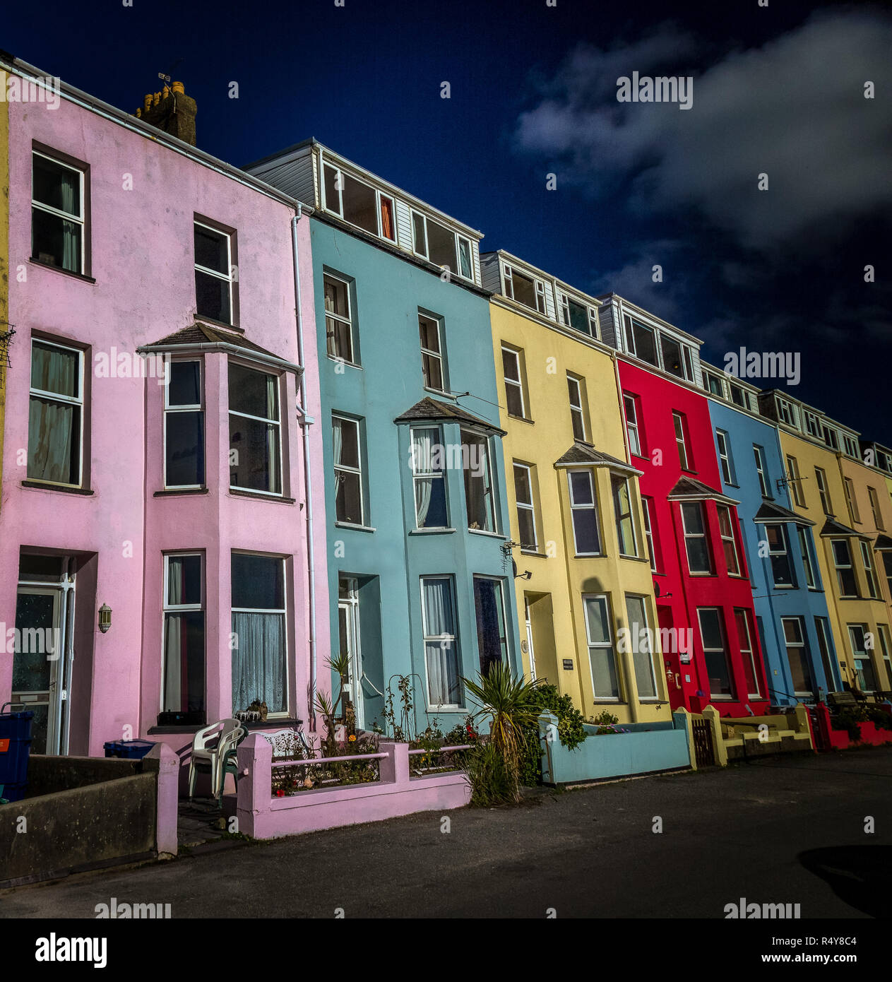 A row of colourful houses in the coastal town of Criccieth in North Wales. Stock Photo