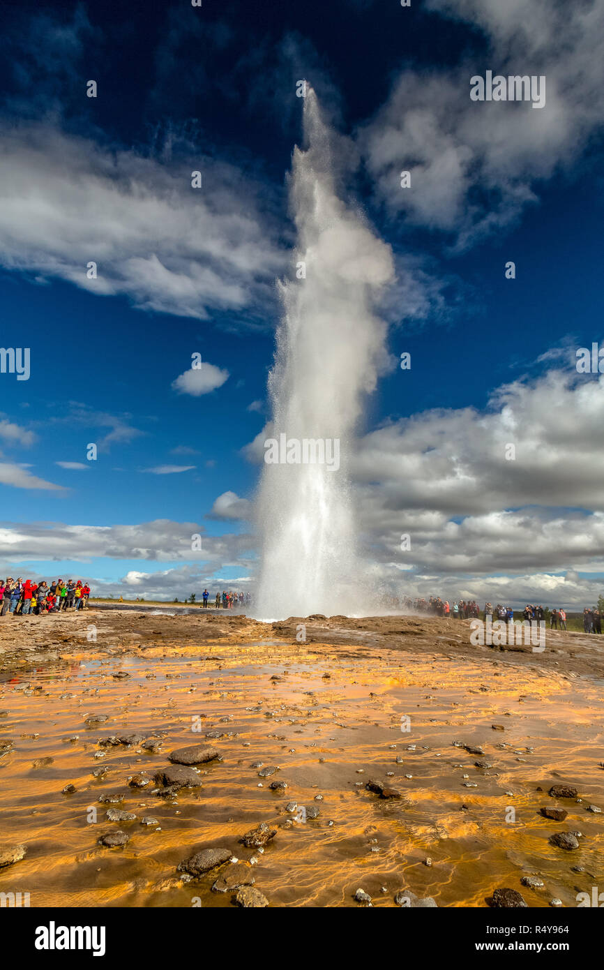 The Geysir Hot Spring Area in Iceland. The Strokkur waterspout seen shooting in to the air. Stock Photo
