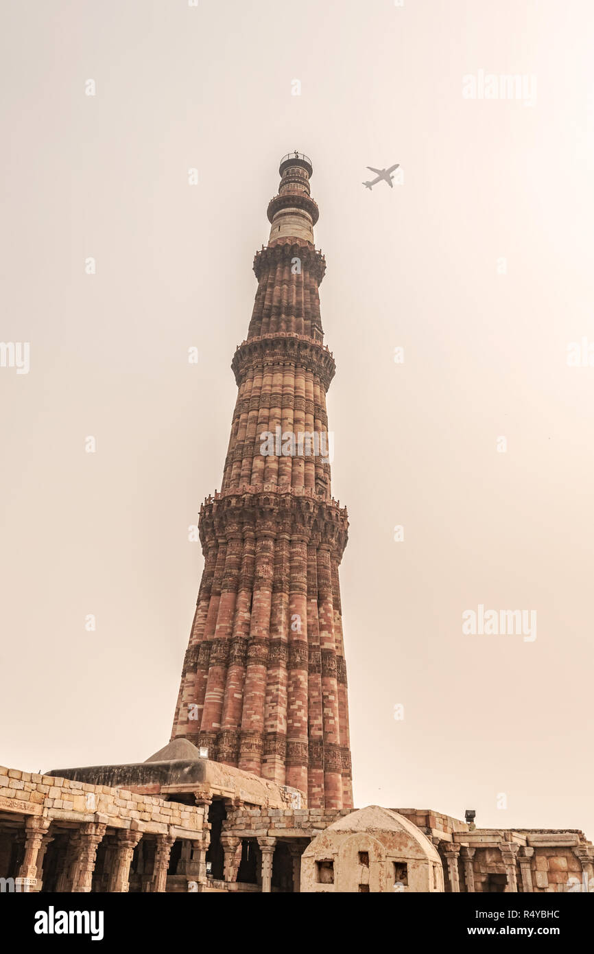 The Qutub or Qutab is the tallest minaret in the world made up of bricks, 73 metre tall tapering tower. Minaret forms part of the Qutab complex, a UNE Stock Photo