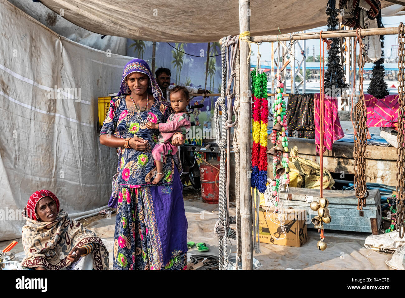 Pushkar, India - Nov 15, 2018: Local woman selling goods at street stand during fair in Pushkar, India Stock Photo