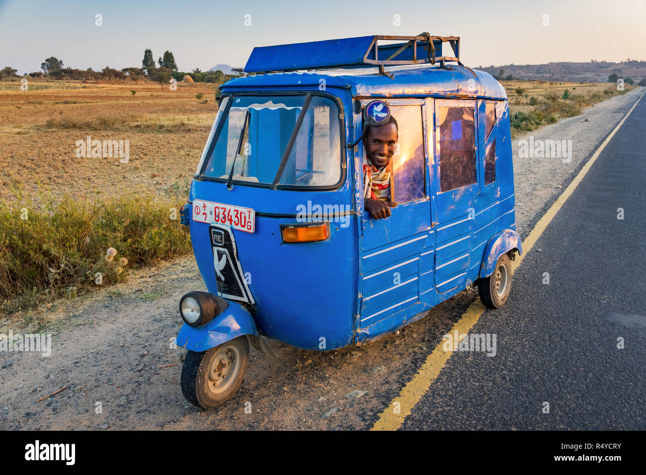 Driver smiles in an auto rickshaw taxi in Megab, Hawzen, Tigray region, Ethiopia Stock Photo
