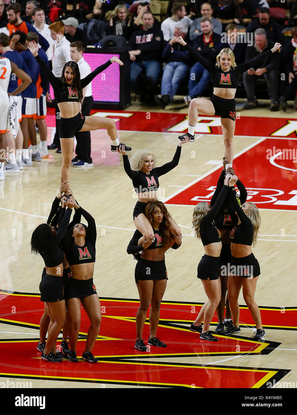 College Park, MD, USA. 28th Nov, 2018. Maryland Terrapins cheerleaders perform during a NCAA Men's Basketball game between the University of Maryland Terrapins and the University of Virginia Cavaliers at the Xfinity Center in College Park, MD. Justin Cooper/CSM/Alamy Live News Stock Photo