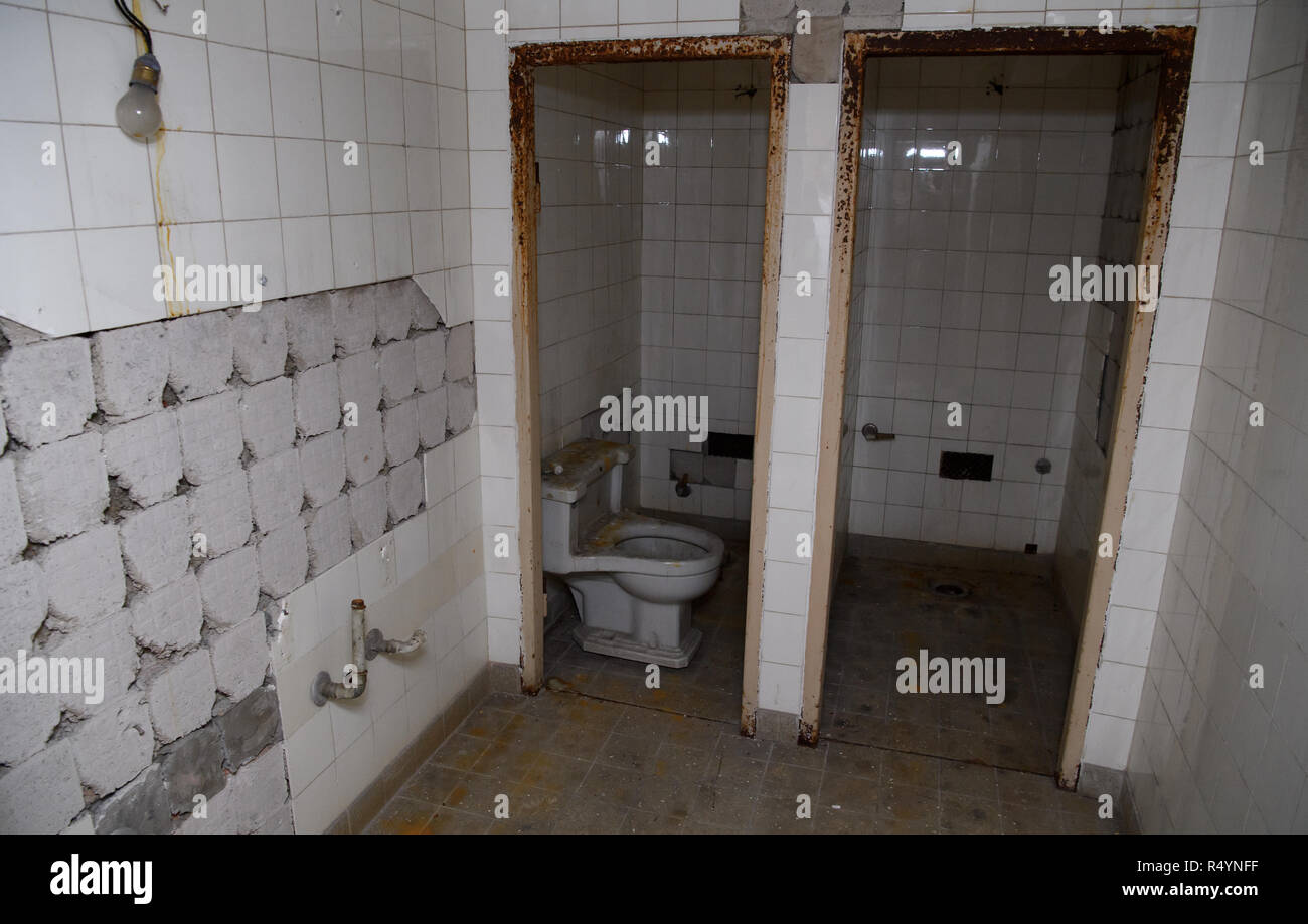 09 November 2018, Bavaria, Pullach: A toilet can be seen in a bunker under the presidential villa on the premises of the Federal Intelligence Service (BND). The villa was once the residence of Martin Bormann, head of the party office of the NSDAP and a confidant of Hitler, and belonged to the former Reichssiedlung Rudolf Heß which was built between 1936 and 1938. From 1947, the buildings were used by the Gehlen organization and later by the Federal Intelligence Service (BND). The Federal Intelligence Service has moved from Pullach to its new headquarters in the middle of Berlin. It was one of Stock Photo