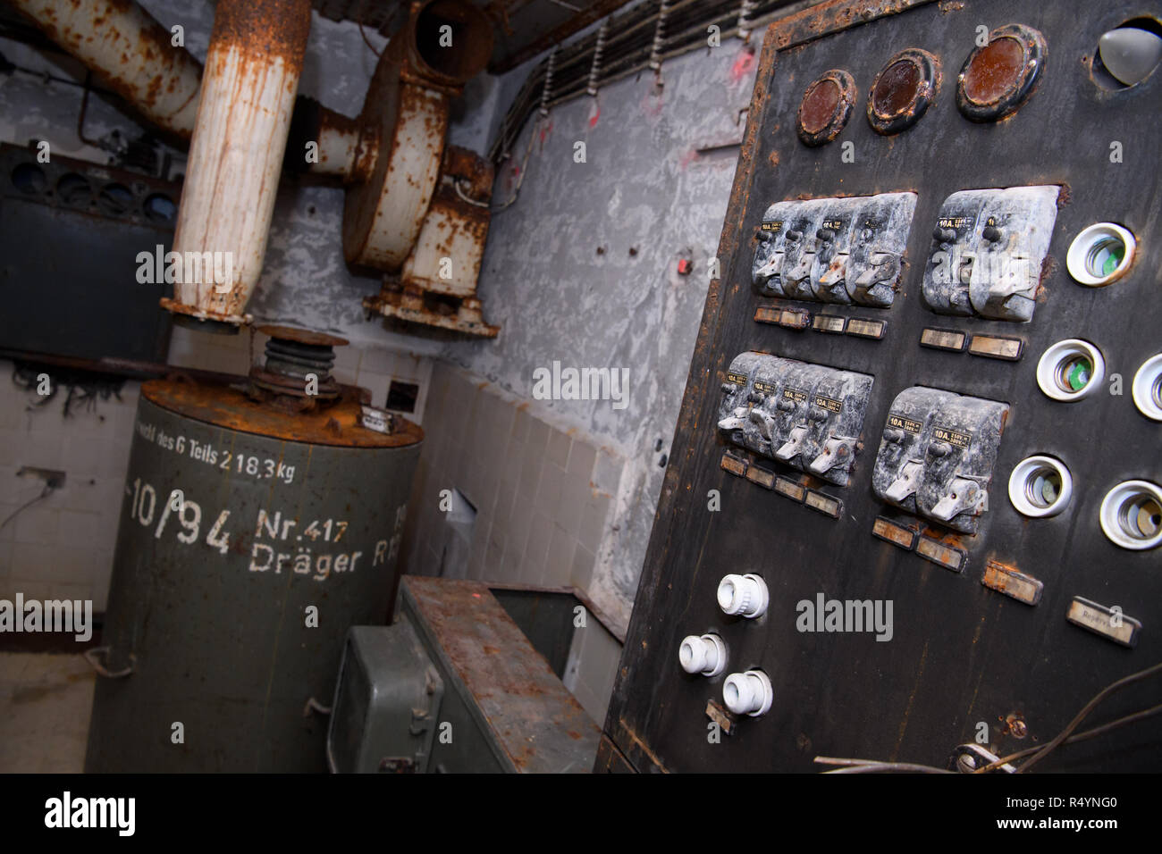 09 November 2018, Bavaria, Pullach: An old fuse box can be seen in a bunker under the presidential villa on the premises of the Federal Intelligence Service (BND). The villa was once the residence of Martin Bormann, head of the party office of the NSDAP and a confidant of Hitler, and belonged to the former Reichssiedlung Rudolf Heß which was built between 1936 and 1938. From 1947, the buildings were used by the Gehlen organization and later by the Federal Intelligence Service (BND). The Federal Intelligence Service has moved from Pullach to its new headquarters in the middle of Berlin. It was Stock Photo