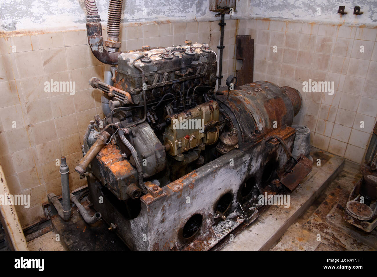 09 November 2018, Bavaria, Pullach: An old diesel generator stands in a bunker under the presidential villa on the premises of the Federal Intelligence Service (BND). The villa was once the residence of Martin Bormann, head of the party office of the NSDAP and a confidant of Hitler, and belonged to the former Reichssiedlung Rudolf Heß which was built between 1936 and 1938. From 1947, the buildings were used by the Gehlen organization and later by the Federal Intelligence Service (BND). The Federal Intelligence Service has moved from Pullach to its new headquarters in the middle of Berlin. It w Stock Photo