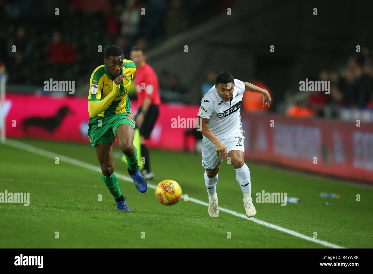 Swansea, Wales, UK. 28th November, 2018. Jefferson Montero of Swansea city goes past Tosin Adarabioyo of West Bromwich Albion (l). EFL Skybet championship match, Swansea city v West Bromwich Albion at the Liberty Stadium in Swansea, South Wales on Wednesday 28th November 2018.  this image may only be used for Editorial purposes. Editorial use only, license required for commercial use. No use in betting, games or a single club/league/player publications. pic by Andrew Orchard/Andrew Orchard sports photography/Alamy Live news Stock Photo