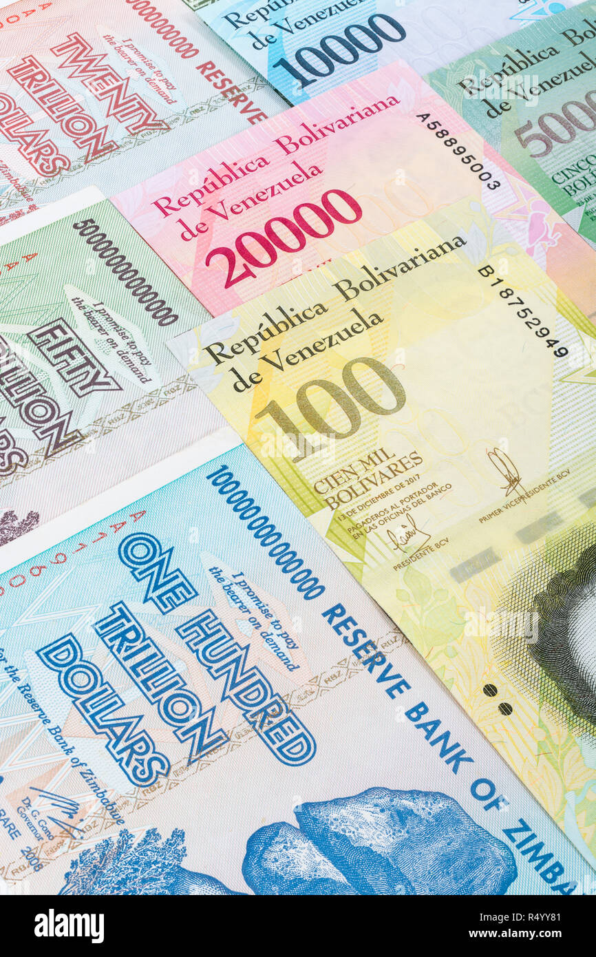 Hyperinflation - 2 classic cases: Zimbabwe 100 Trillion Dollar banknote (largest denomination banknote ever printed, in 2008), and Venezuelan Bolivars Stock Photo