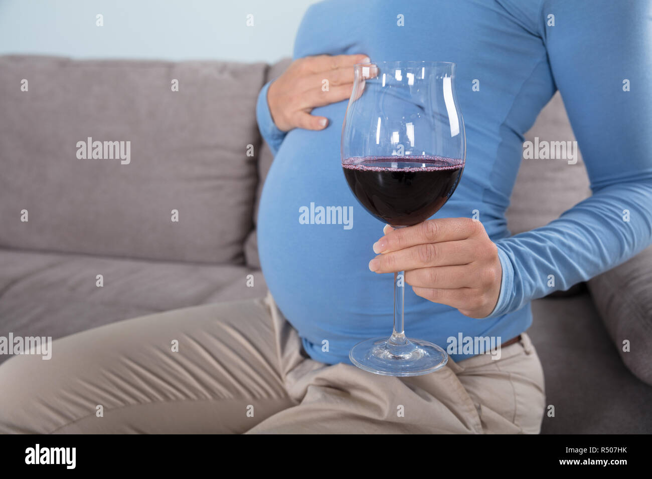 Pregnant Women Drinking Red Wine Stock Photo Alamy