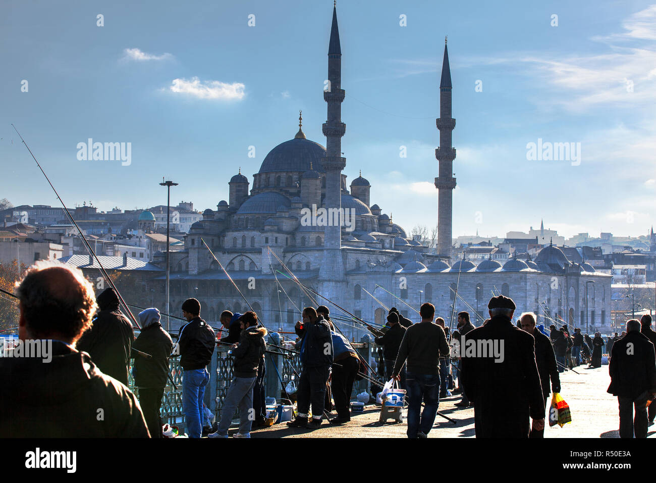 New Mosque at the back side of the Fishermen on Galata Bridge. Eminonu, Istanbul, Turkey. Stock Photo