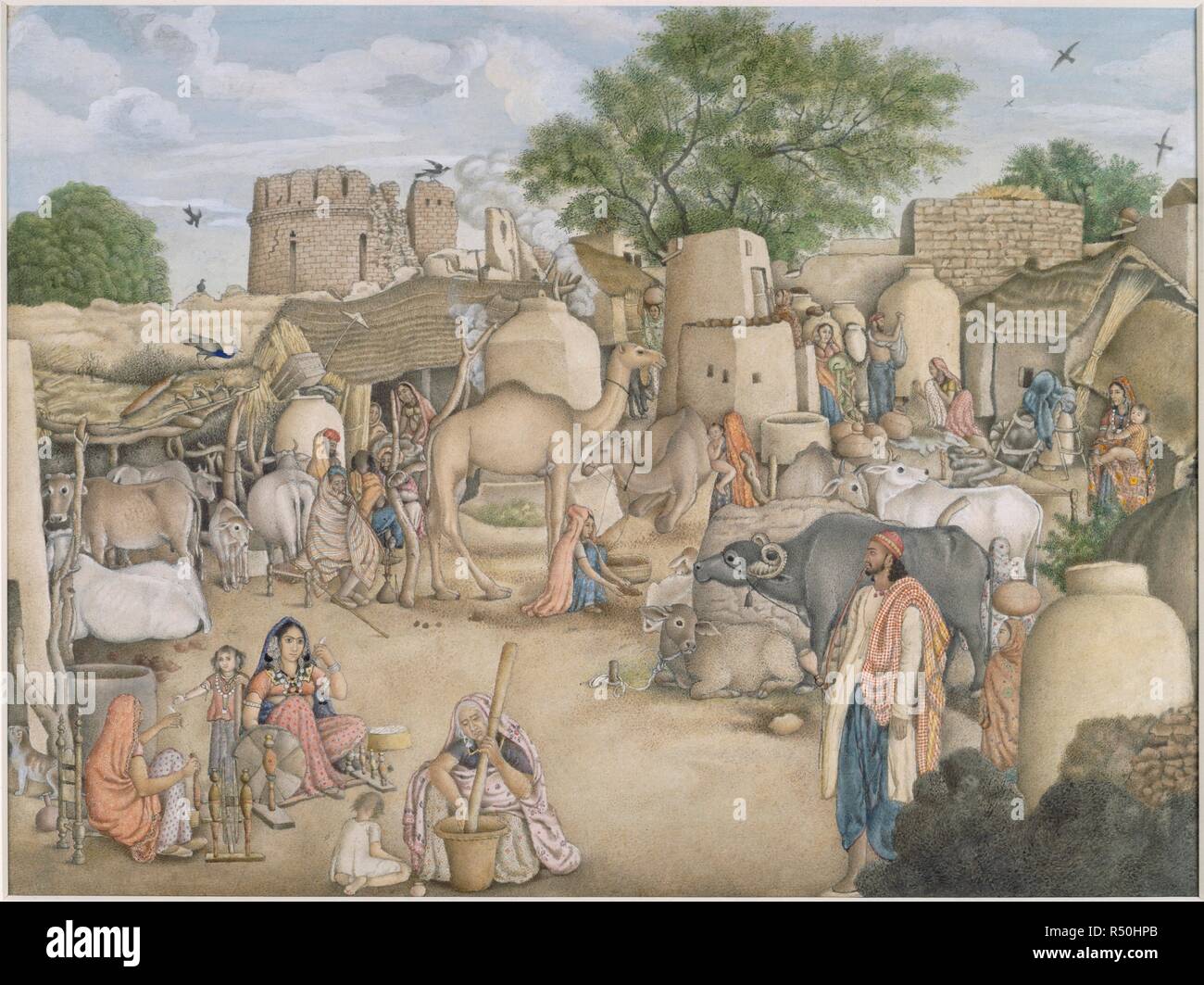 A street scene in the village of Raniya. In the foreground a young woman sits spinning, a child beside her and other women around her. In the background between the houses and giant jars are cattle, camels and numerous other figures going about their business. 1816-1820. Opaque watercolour. Source: Add.Or.4057. Stock Photo