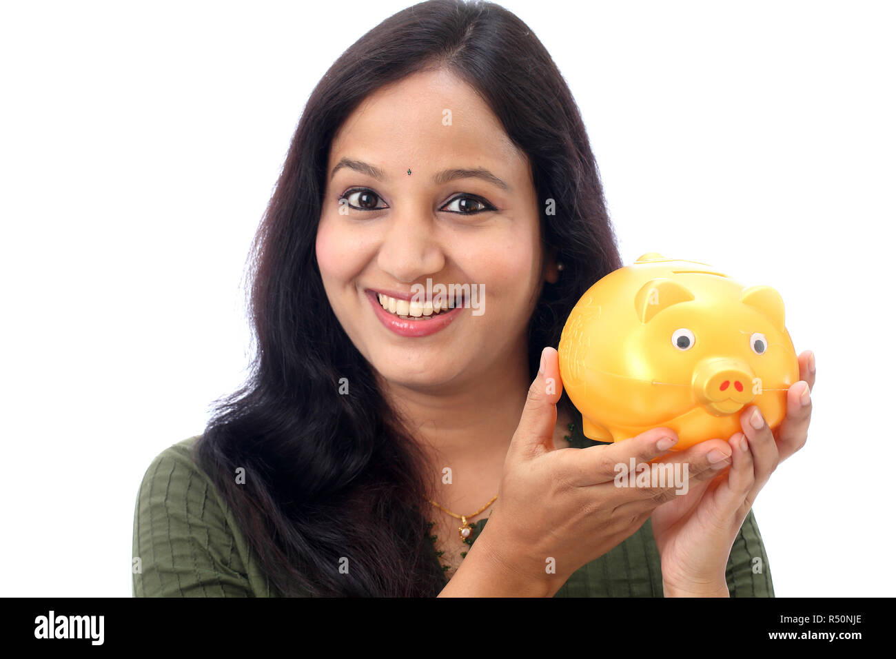 Young Indian Woman Saves Money in Piggy bank Stock Photo - Alamy