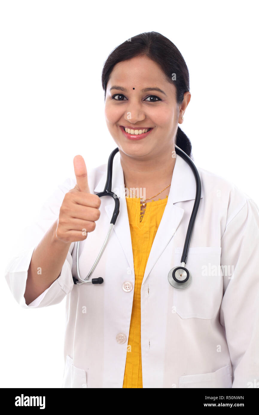 Young Indian Female Doctor showing thumbs up on white background Stock ...