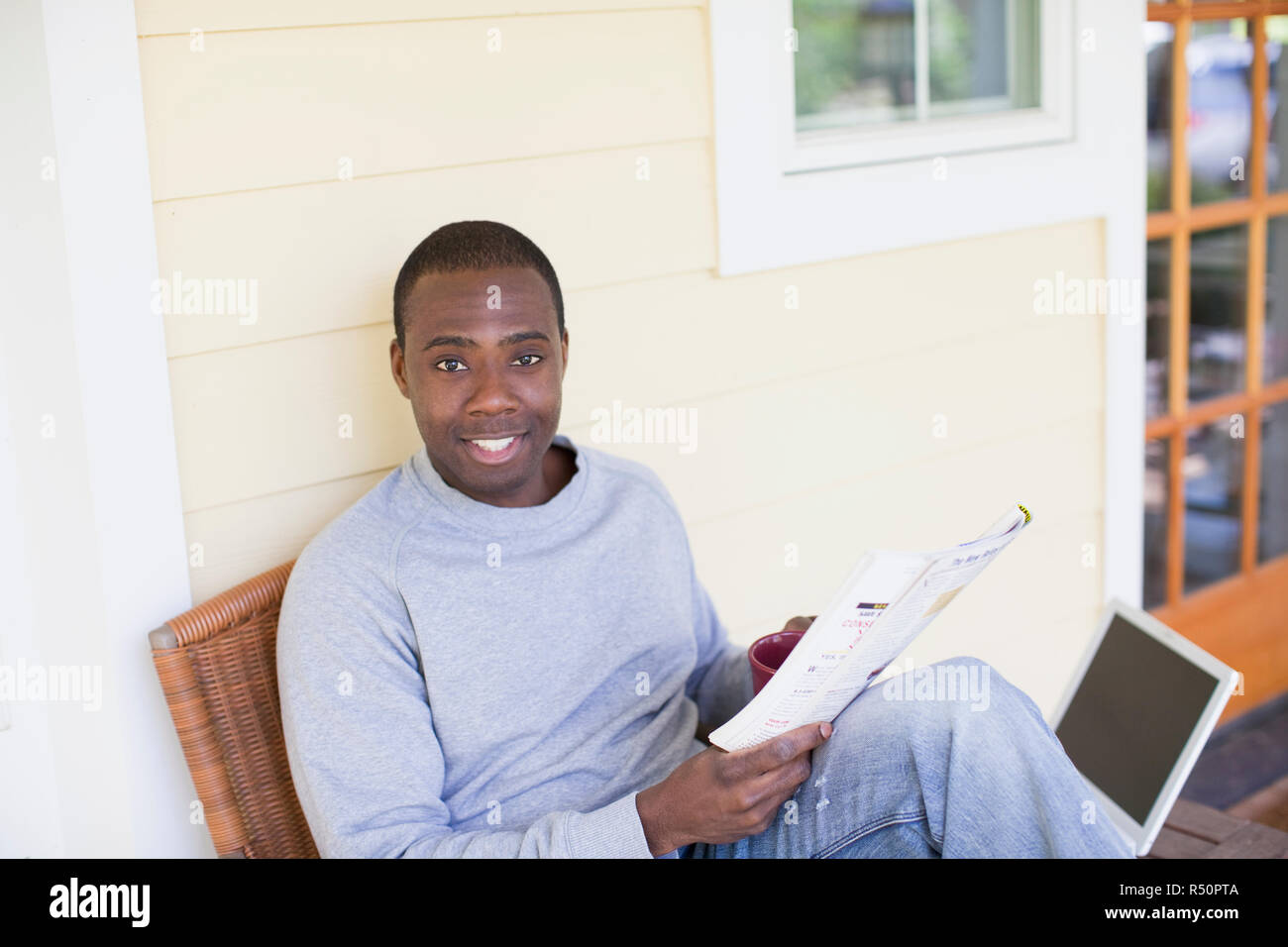 Black man laptop computer outside patio hi-res stock photography and ...