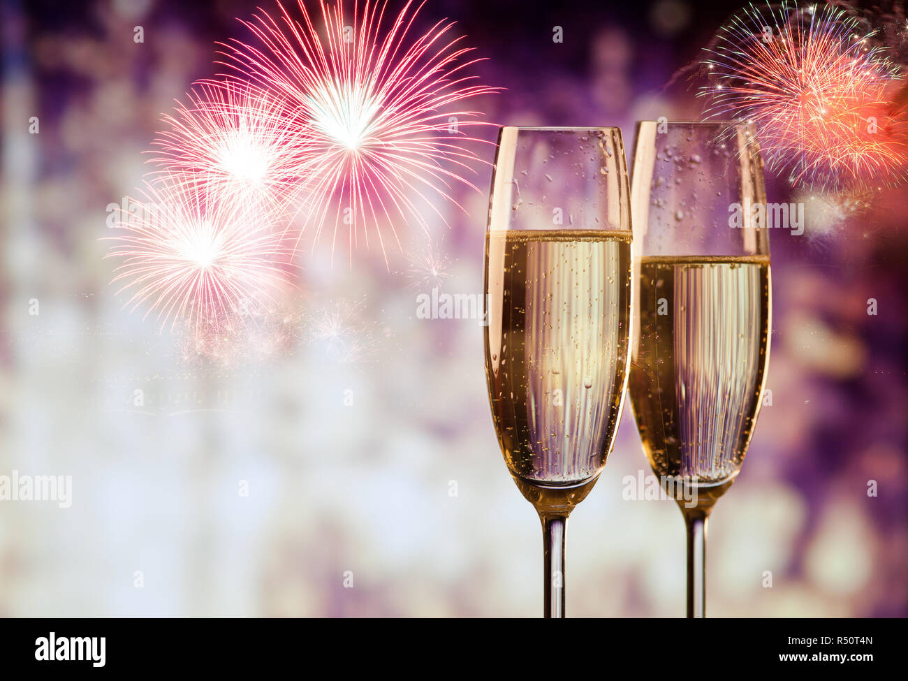 two champagne glasses ready to bring in the New Year Stock Photo - Alamy