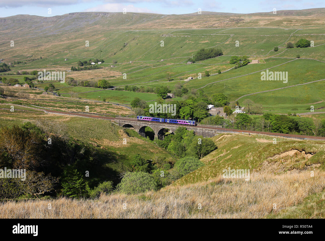 A 158 heads over Ais Gill viaduct with a Carlisle to Leeds Northern service. Stock Photo