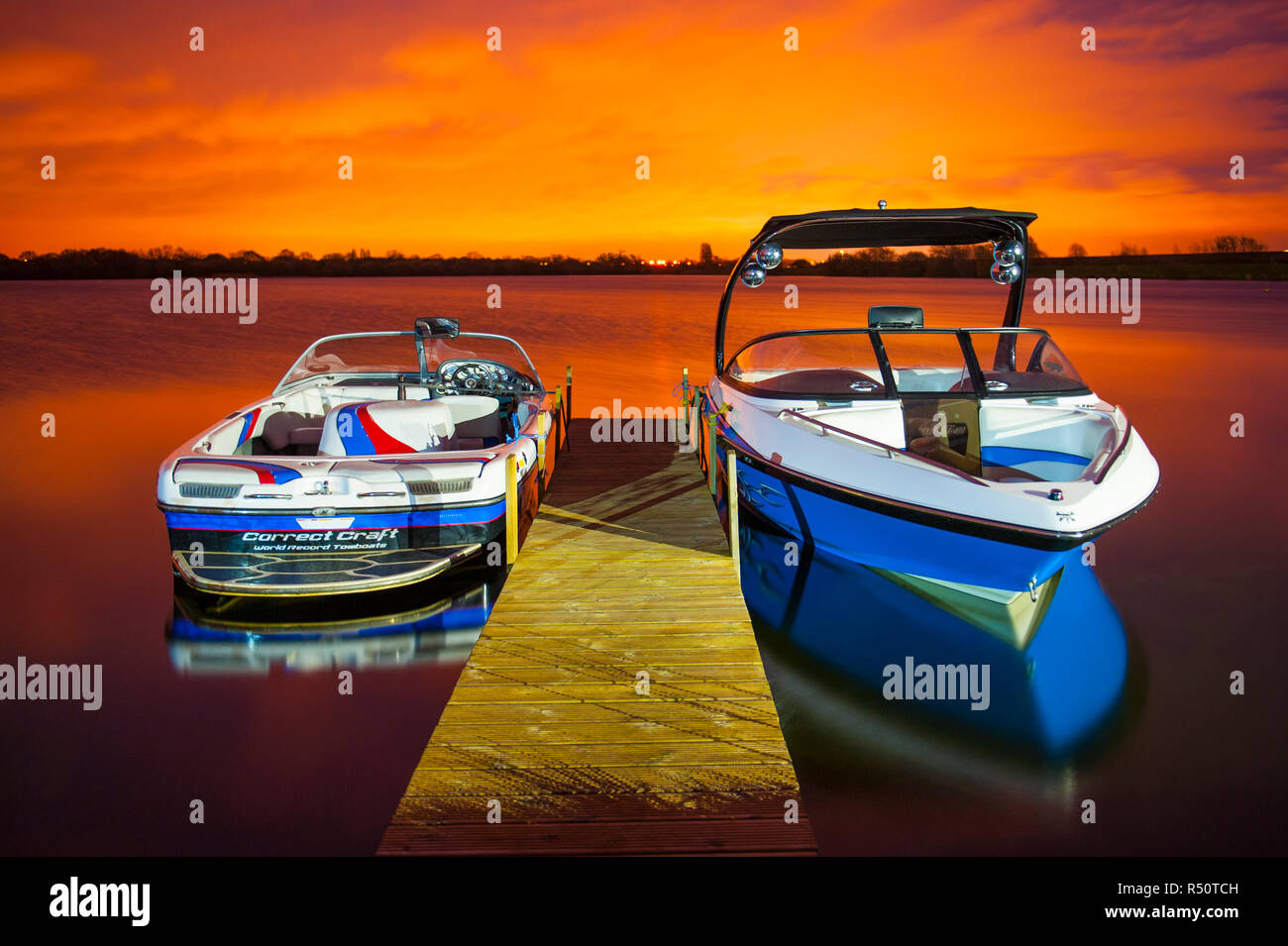 Wakeboarding Boats at Sunset Stock Photo