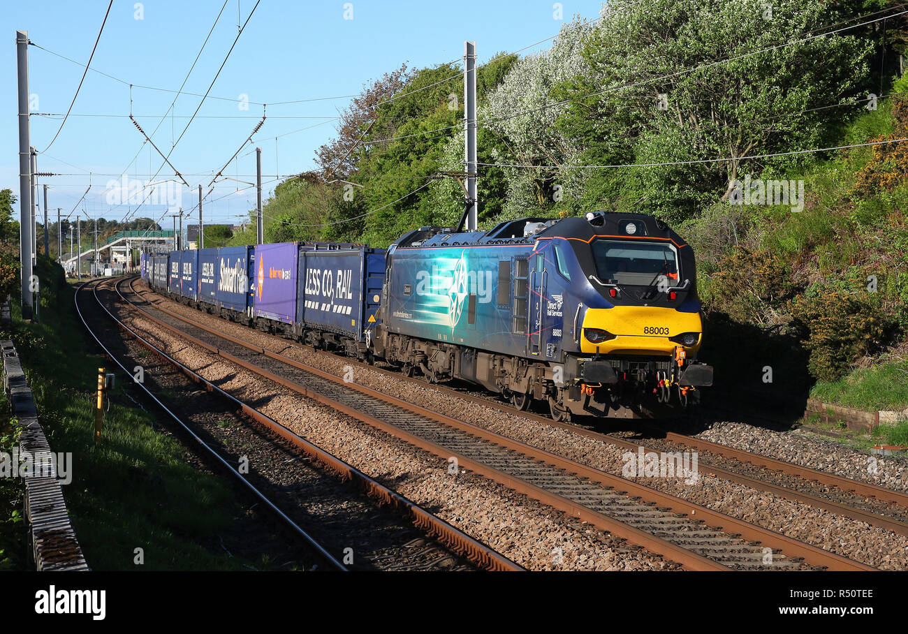 88003 heads past Hest Bank on 13.5.18 with the Mossend to Daventry Tesco express. Stock Photo