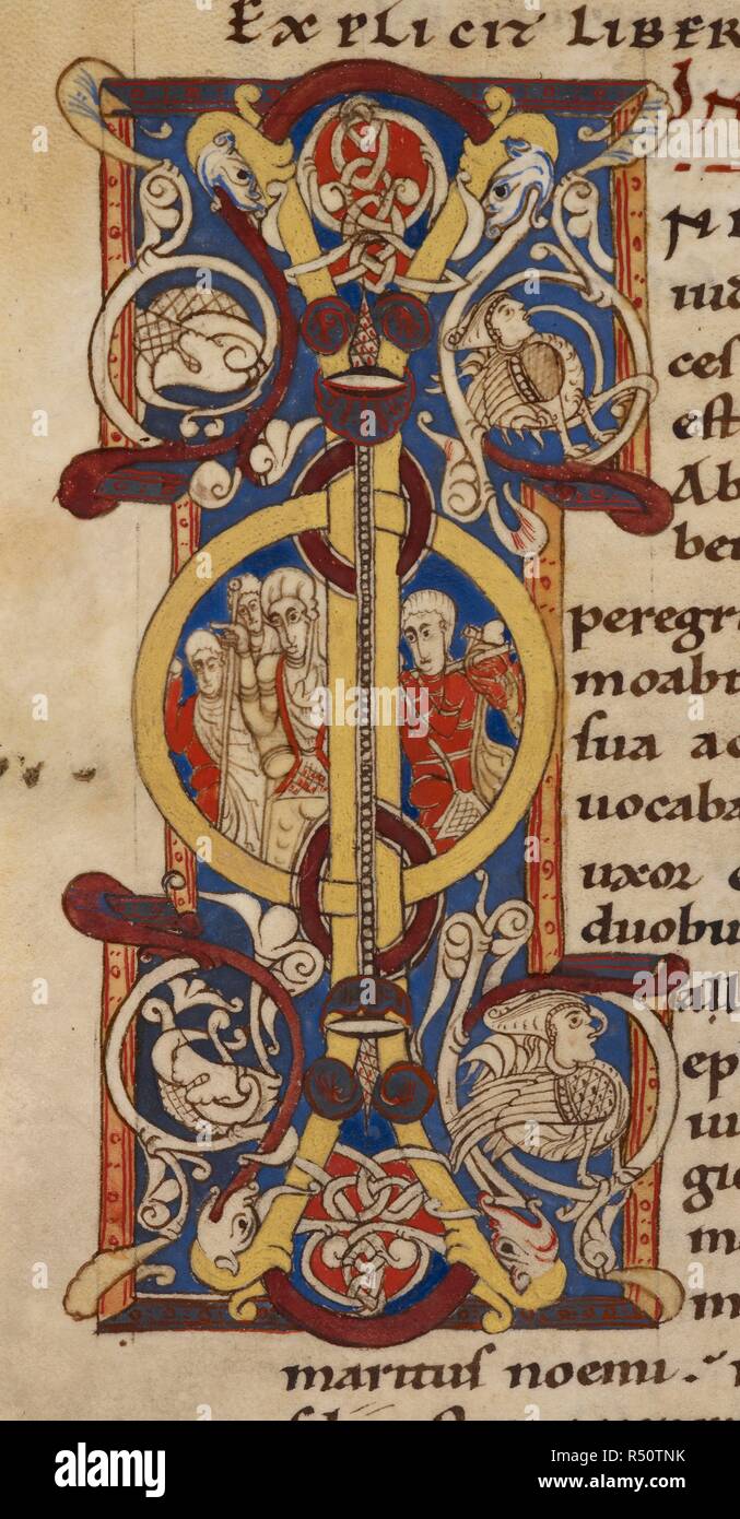 Historiated initial from The 'Montpelier Bible'. The 'Montpelier Bible'. France, S. (Languedoc). Bible (The 'Montpellier Bible') (Genesis to Malachi). 1st quarter of the 12th century. Historiated initial with Elimelech, Naomi, and their sons on their journey to Moab, at the beginning of Ruth (the first known occurrence of this depiction in medieval art). The initial is decorated also by two sirens or hybrids, which have a less clear connection with the text. Source: Harley 4772 f.120v. Language: Latin. Stock Photo